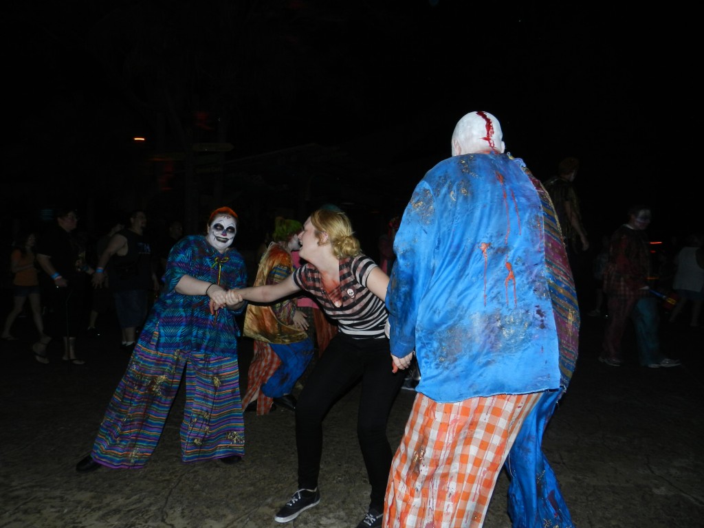 Howl-O-Scream Busch Gardens Tampa Bay. Zombie clowns taking away Busch Gardens worker. Keep reading for more Busch Gardens Howl O Scream tips and survival guide. Photo Copyright ThemeParkHipster.