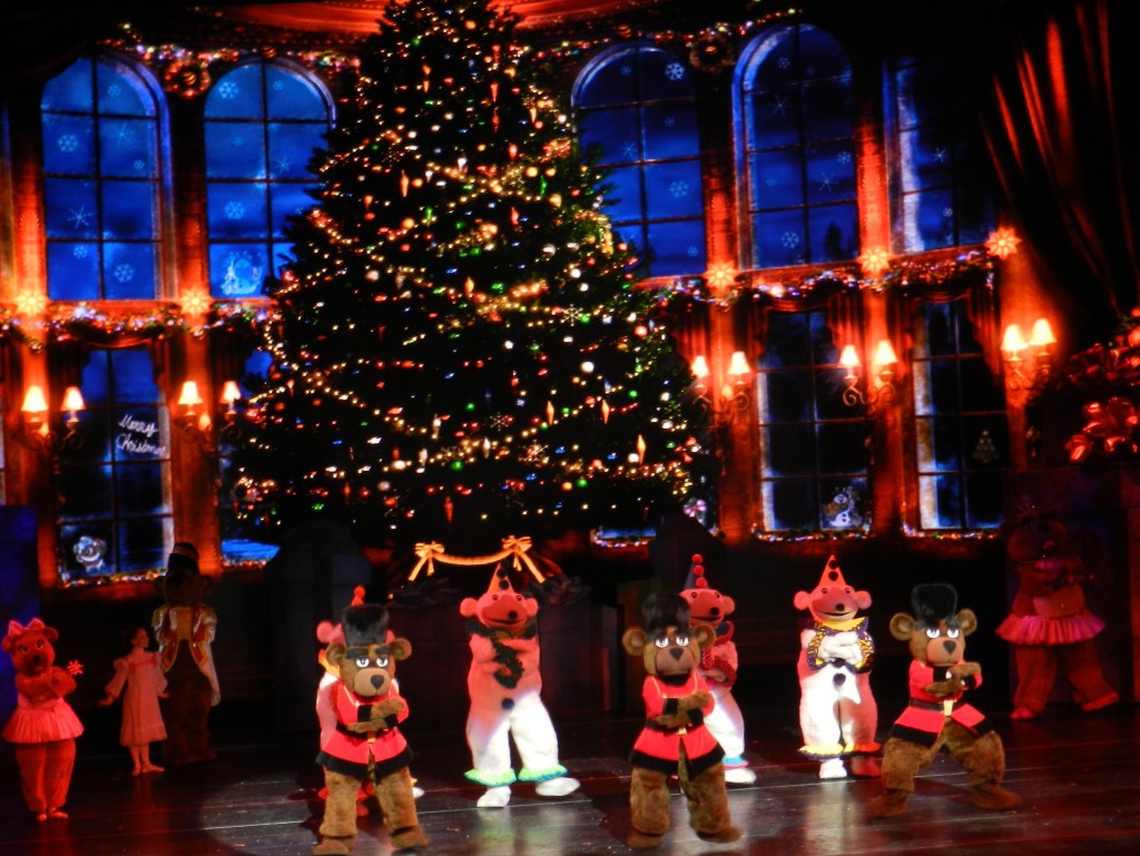 Radio City Christmas Spectacular with Rockettes in Teddy Bear Gear Near Christmas Tree. Photo copyright ThemeParkHipster.