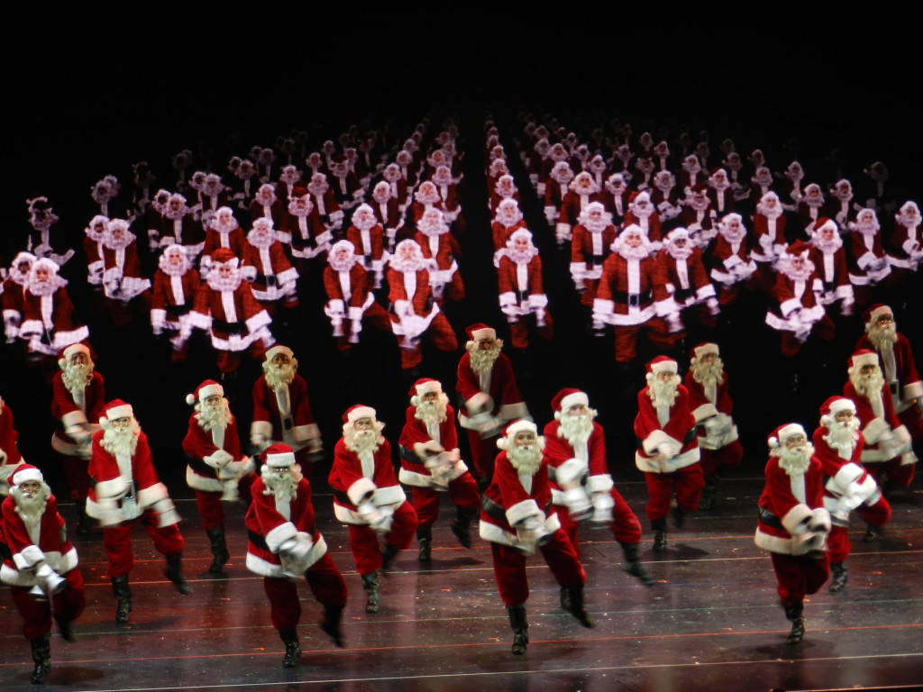 Radio City Christmas Spectacular with Rockettes in Santa Claus Suits. Photo copyright ThemeParkHipster.