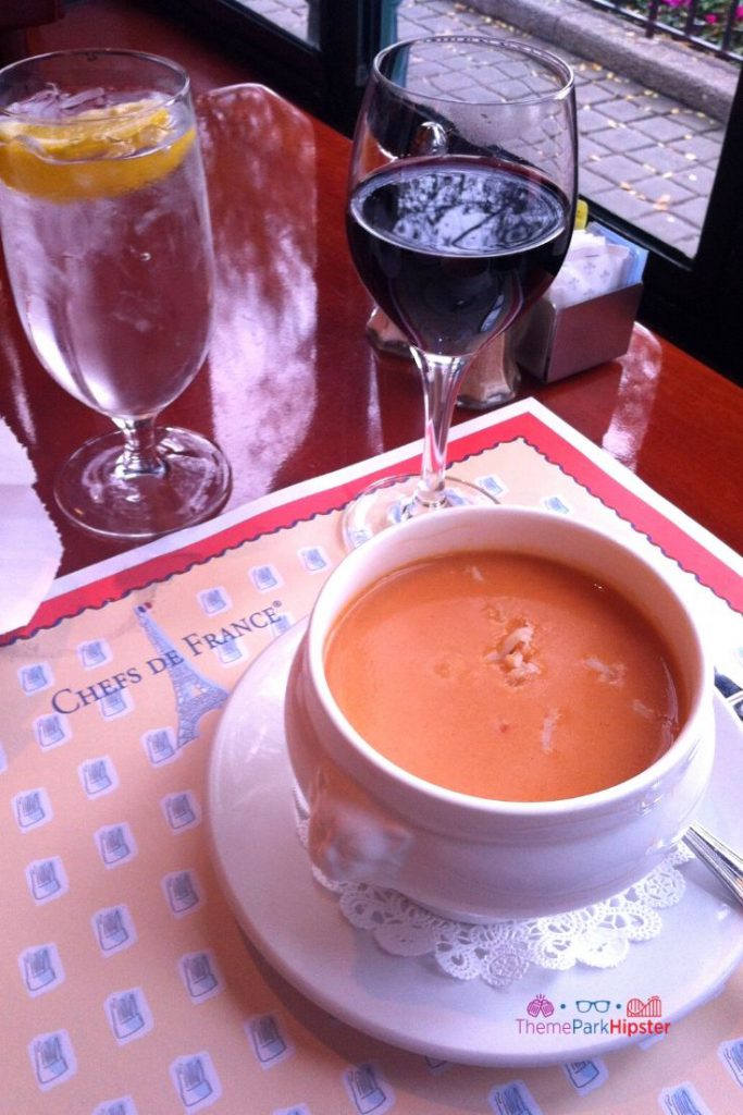 Creamy Lobster Bisque and Red Wine at Chefs de France Disney World. One of the best places to put on your Orlando bucket list!