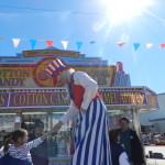 Uncle Sam on Stilts Greeting Kids.