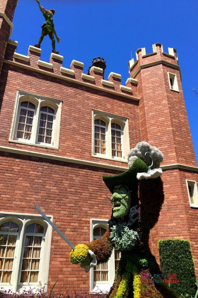 UK Pavilion at Epcot with Captain Hook topiary angry at Peter Pan. Keep reading to get the full guide and review to Rose and Crown Dining Room and Pub at Epcot in Walt Disney World Resort.