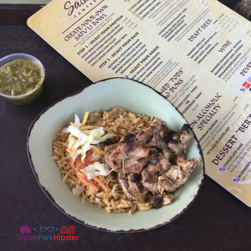 Disney Mobile Ordering with colorful grilled chicken and rice. One of the best quick service and counter service restaurants at Animal Kingdom.