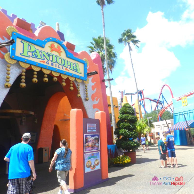 Colorful Pantopia Busch Gardens Tampa with red roller coaster Scorpion in background.