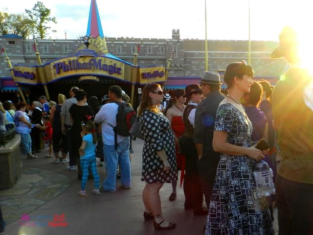 Dapper Day Disney World People in front of PhillarMagic. Keep reading to get the best Dapper Day tips at Disney!