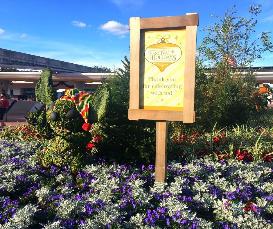 Christmas Epcot Festival of the Holidays with Stitch topiary.