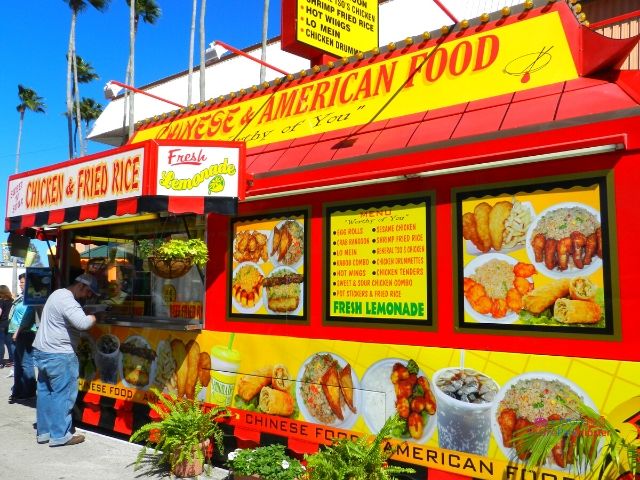 Florida State Fair Food Chinese American Kiosk with Chicken Fried Rice Display. Keep reading to get the full Florida State Fair Guide with Tickets, Food, Concerts, Rides and More!