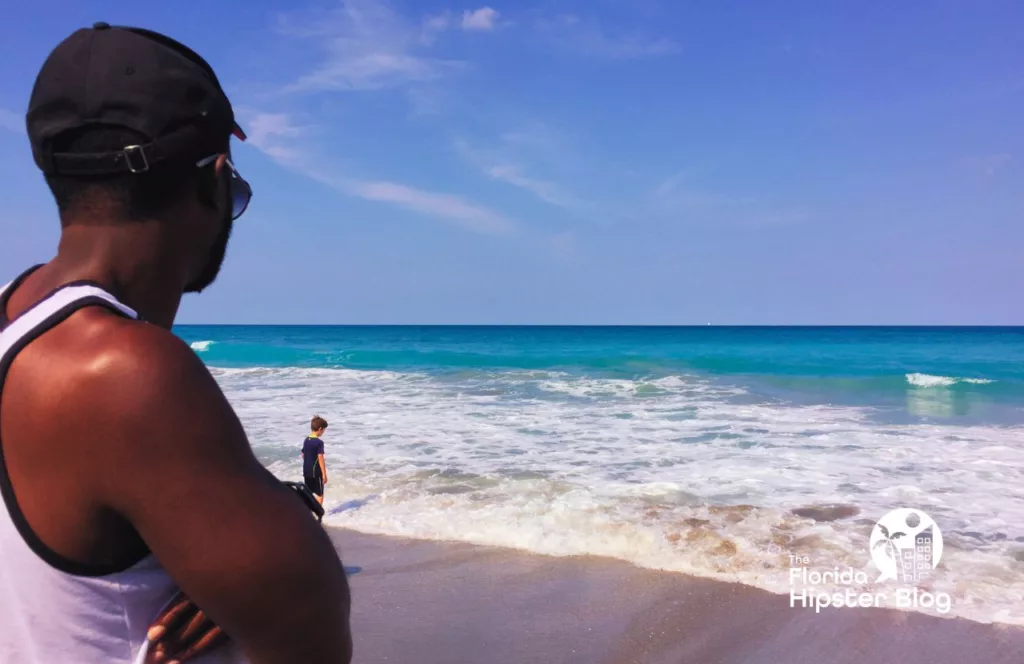 Man looking at the ocean in Jupiter Beach Florida