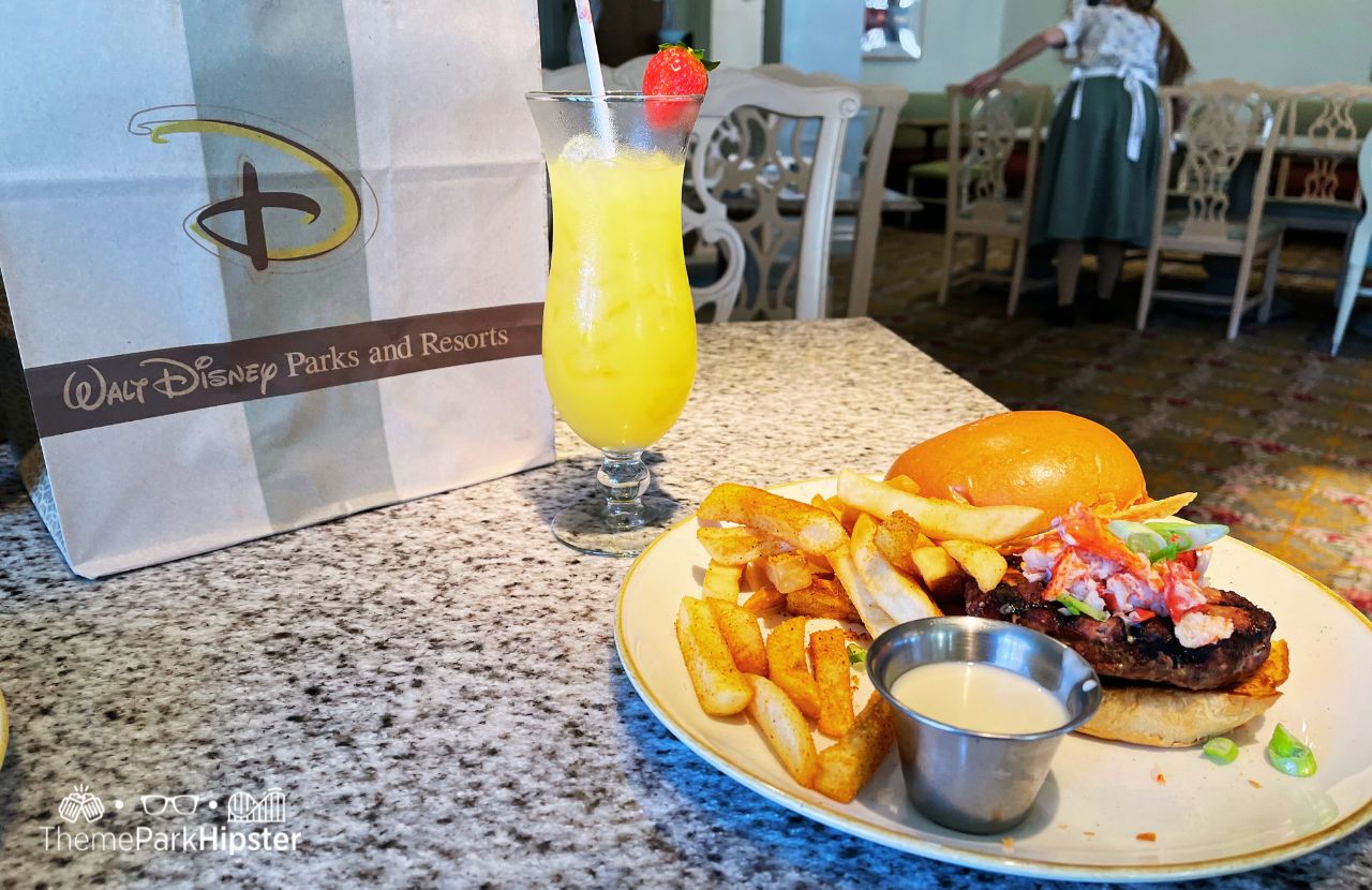 Disney's Grand Floridian Cafe Restaurant Mimosa and Lobster Burger. One of the best restaurants at Disney World.