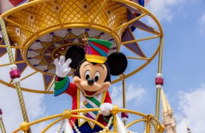 Mickey Mouse on Festival of Fantasy Parade at Magic Kingdom with the best Disney Shirt and Tie on for the ultimate Disney World packing list.