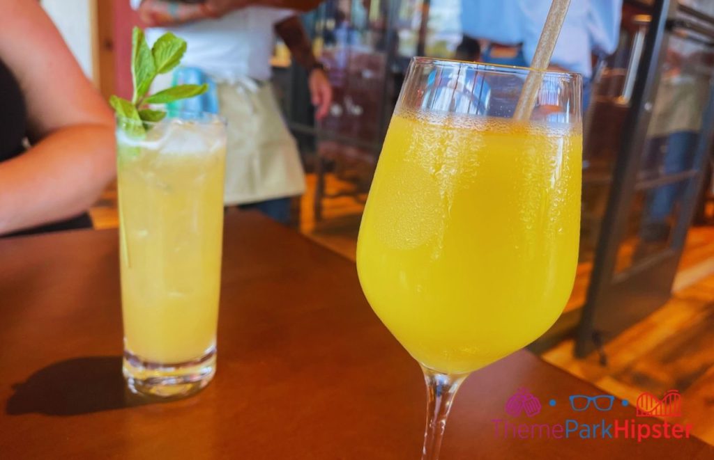 Wine Bar George Mai Tai and Dole Whip Mimosa. Keep reading to get the best things to do at Disney Springs for solo travelers on a solo disney world trip.