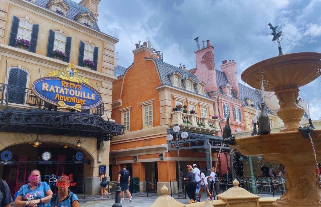 New Ratatouille Ride at Epcot front entrance with fountain. Keep reading to know what the best days to visit Disney World parks and how to use the Disney World Crowd Calendar.