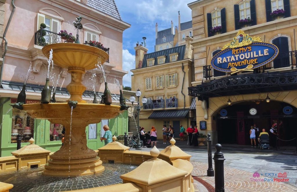 Entrance to Remys Ratatouille Adventure with mouse waterfall. Keep reading to get the full guide on having the best Epcot solo trip on your Disney World vacation alone.