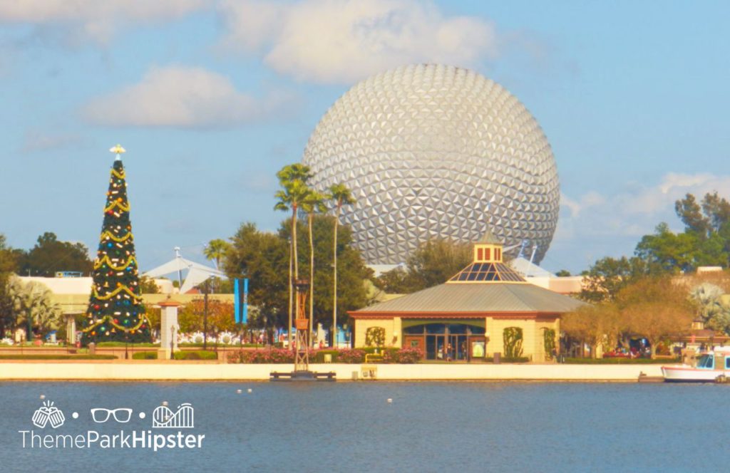 Christmas at Walt Disney World Epcot World Showcase with Tall Christmas Tree. Keep reading to get the best Disney Christmas pictures and to know where to take the best Christmas photos at Disney World!