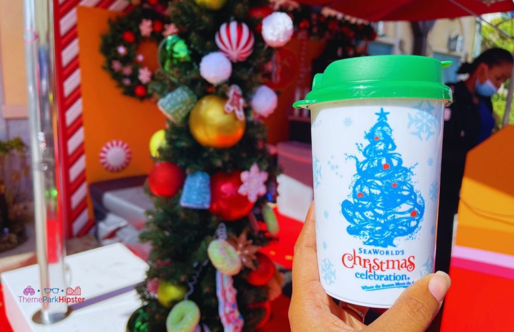 SeaWorld Christmas Celebration Hot Chocolate in souvenir cup. Keep reading to find out more about SeaWorld Orlando Christmas Celebration food.