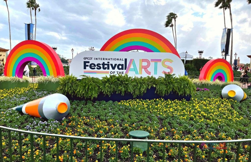 Epcot International Festival of the Arts 2024 Large Yellow and Orange Painting on Grass. Keep reading to get the best time to visit Disney World. 