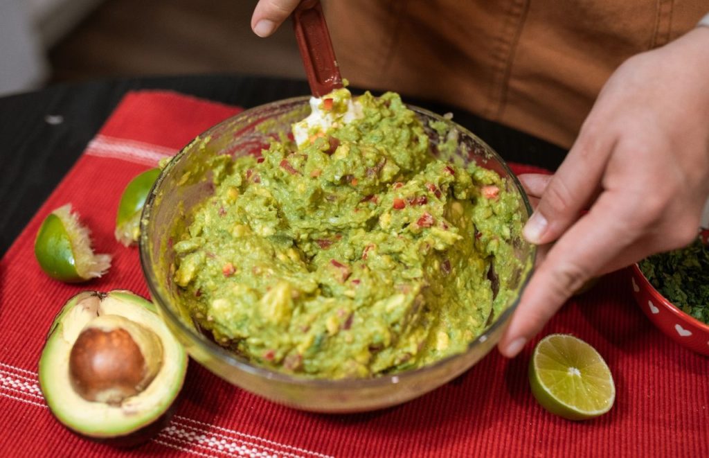 Bowl of guacamole at Epcot Mexican Restaurant. Keep reading the get the worst and best snacks at Disney World.