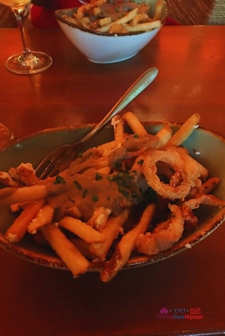 Nomad Lounge in Animal Kingdom Truffle Poutine. Making it one of the best restaurants in Animal Kingdom.