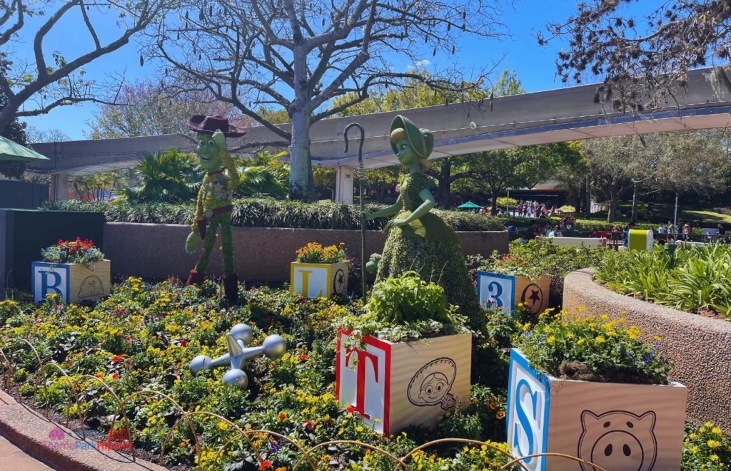 Epcot Flower and Garden Festival Toy Story Topiary with Woody and Bo Peep. Keep reading to learn how to go to Epcot Flower and Garden Festival alone and how to have the perfect solo Disney World trip.