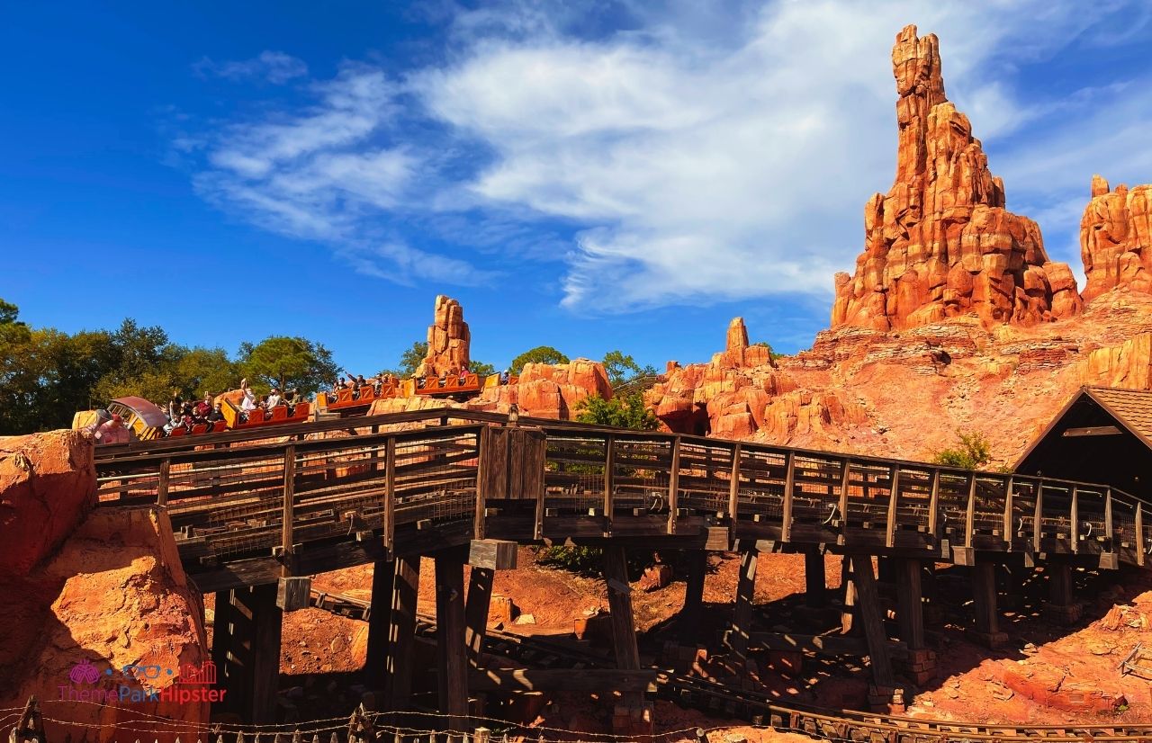 Disney Magic Kingdom Big Thunder Mountain Railroad roller coaster going over the bridge Frontierland