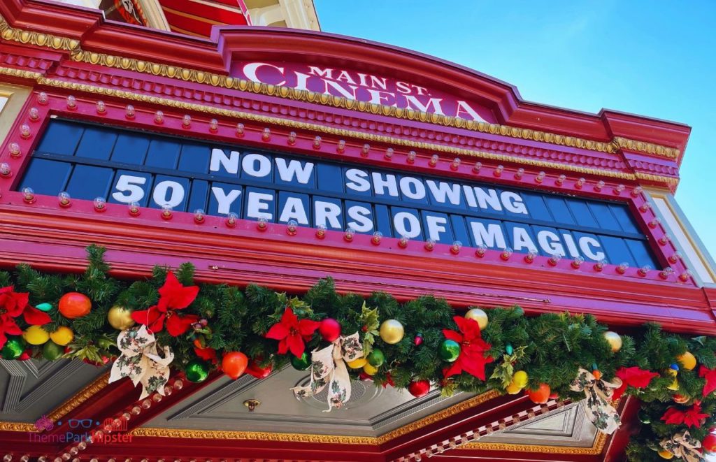 Disney Magic Kingdom Main Street Cinema. Keep reading to learn how to survive your first Disney World Christmas trip and the Disney Christmas decorations.