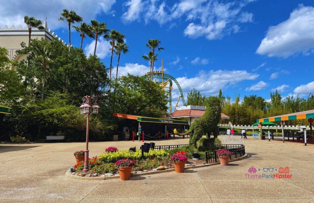 Busch Gardens Tampa Bay outside entrance showing tiger topiary and cheetah hunt. Keep reading to learn more about avoiding the Busch Gardens Tampa wait times and if the Busch Gardens Tampa Queue Pass is worth it...