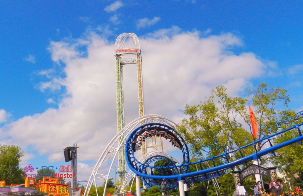 Cedar Point Power Tower behind Corkscrew roller coaster. Keep reading to know what to pack for an amusement park and have the best theme park packing list.