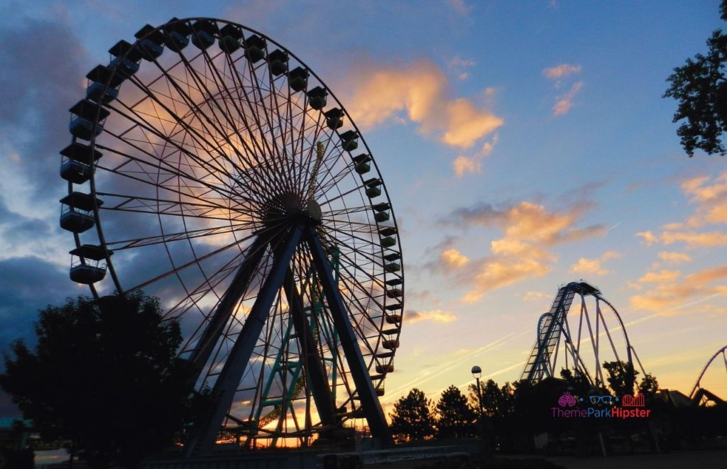 Cedar Point Sunrising Gatekeeper and Ferris Wheel. Keep reading to see where to find cheap Cedar Point tickets at a discount 2024.