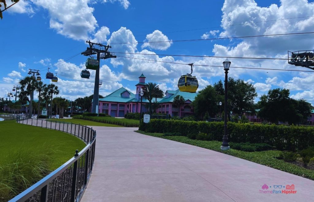 Disney Riviera Resort Caribbean Beach Club behind skyliner. One of the best Disney Moderate Resorts for Solo Travelers on a Solo Disney Trip. 