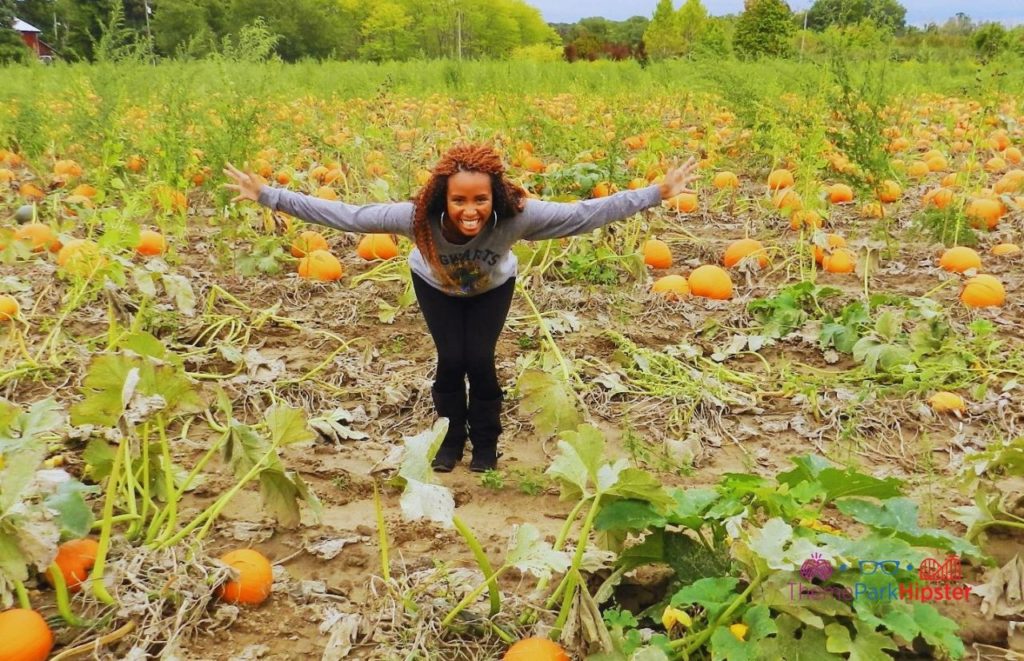 NikkyJ happy in the pumpkin patch. Keep reading to find out the best Disney Thanksgiving episodes and movies to watch this holiday.  