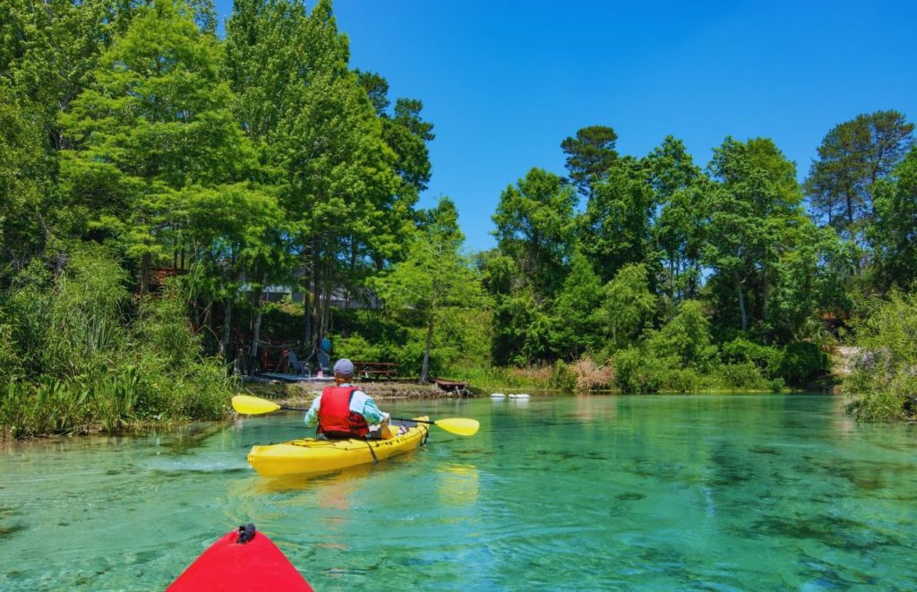 Kayaking at Crystal River Florida. Keep reading to find out more about the best places to travel solo in Florida.  