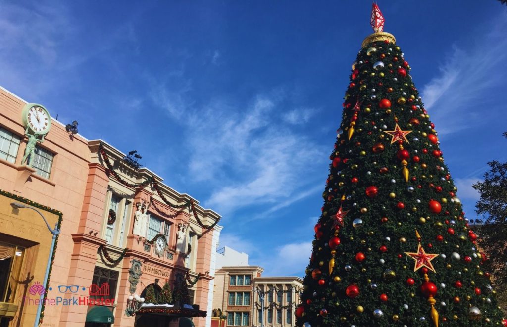 Universal Orlando Resort Christmas Tree in Central Park of Universal Studios Florida. Keep reading to get the full guide to Christmas at Universal Orlando Resort!