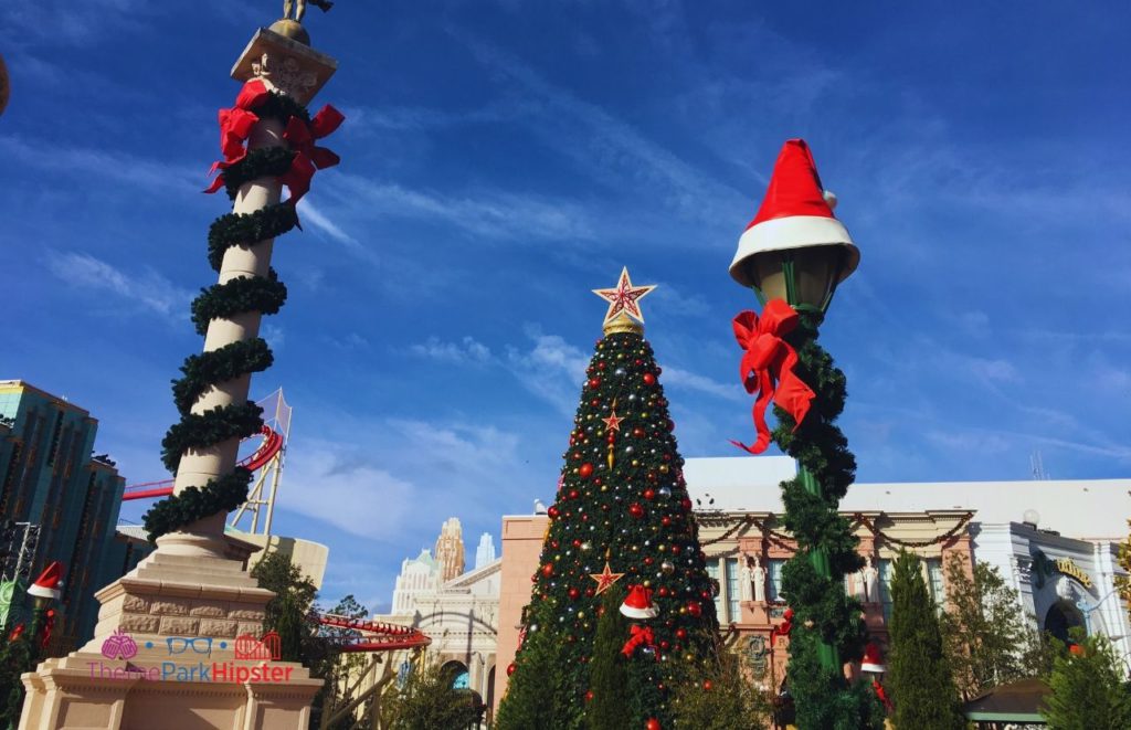 Universal Orlando Resort Giant Christmas Tree in Central Park of Universal Studios Florida. Keep reading to get the best things to do at Universal Studios Orlando Florida.