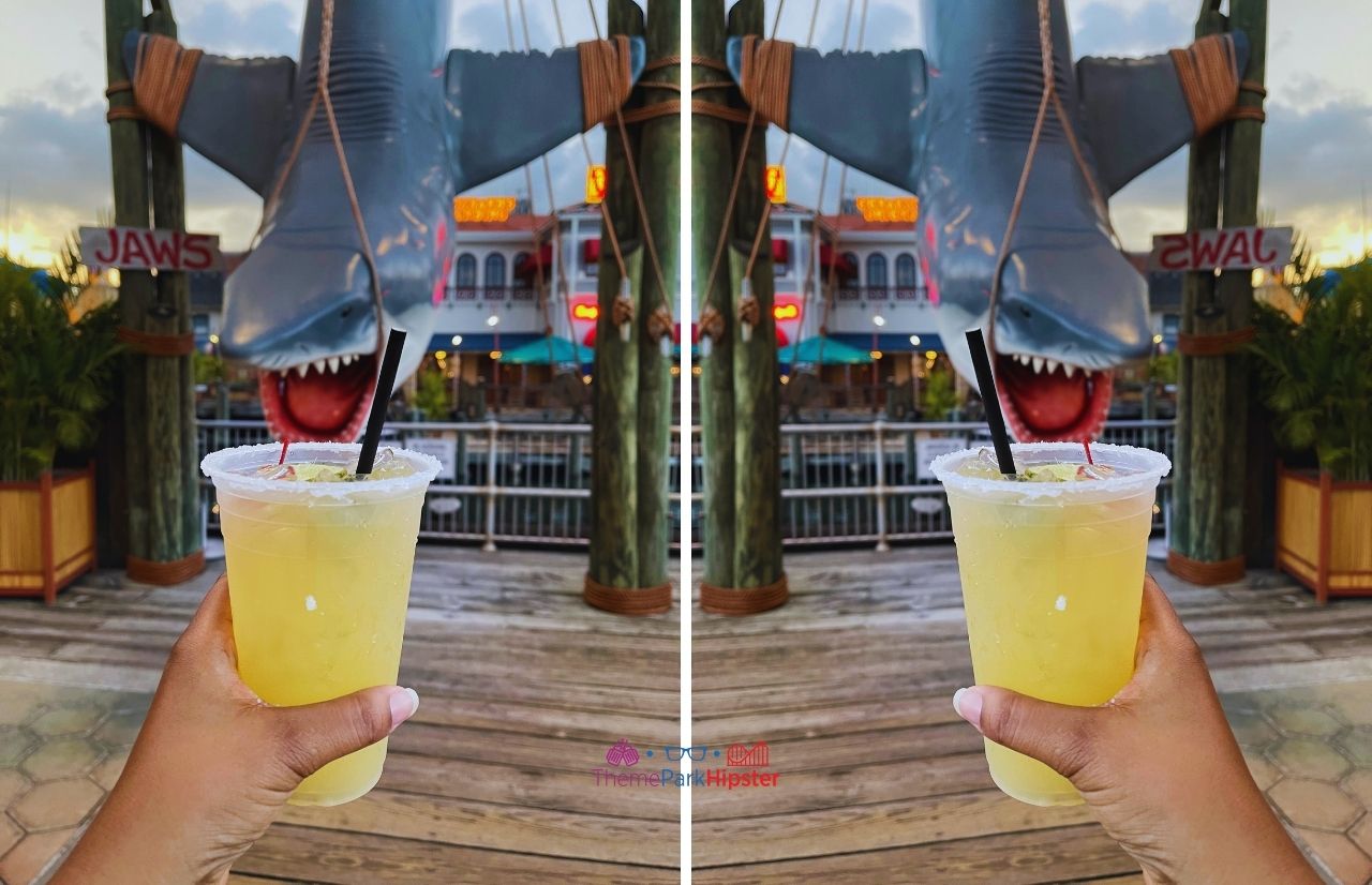 Universal Orlando Resort a margarita at Chez Alcatraz with Jaws Bruce the Shark in background at Universal Studios