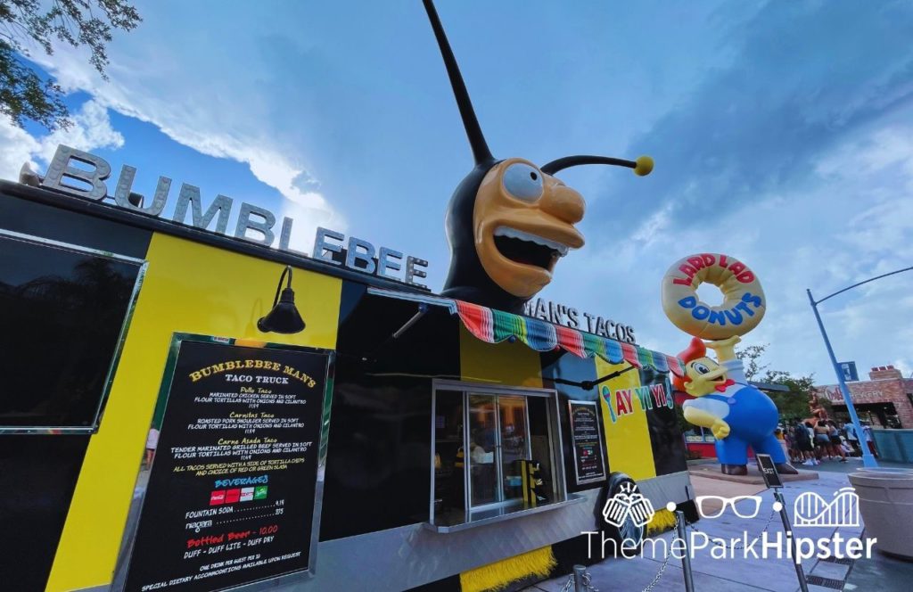 Universal Orlando Resort Bumblebee Man's Tacos in Springfield Simpsons Land with Lard Lad Donuts in background at Universal Studios Florida. Home of the BIG Pink Donut.