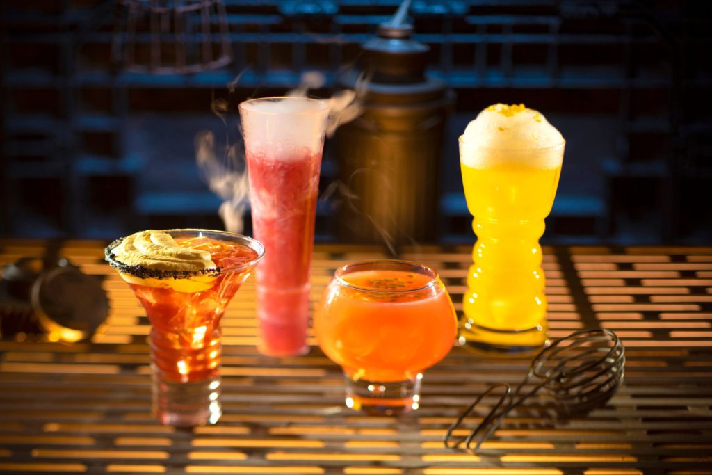 From Left to Right The Outer Rim, Bespin Fizz, Yub Nub, and Fuzzy Tauntaun can be found at Oga’s Cantina at Star Wars Land in Disneyland and Hollywood Studios. Keep reading to find out what best drinks at Oga's Cantina are in Disney World Hollywood Studios and Disneyland.