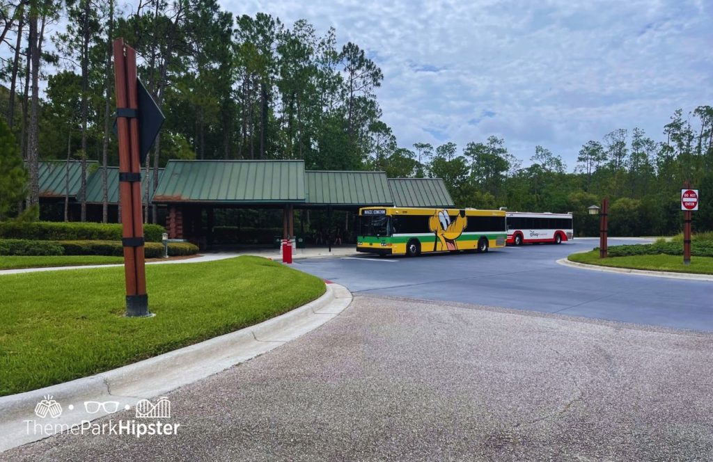 Disney Wilderness Lodge at Christmas with bus stop. One of the best things to Do at Disney World for Christmas