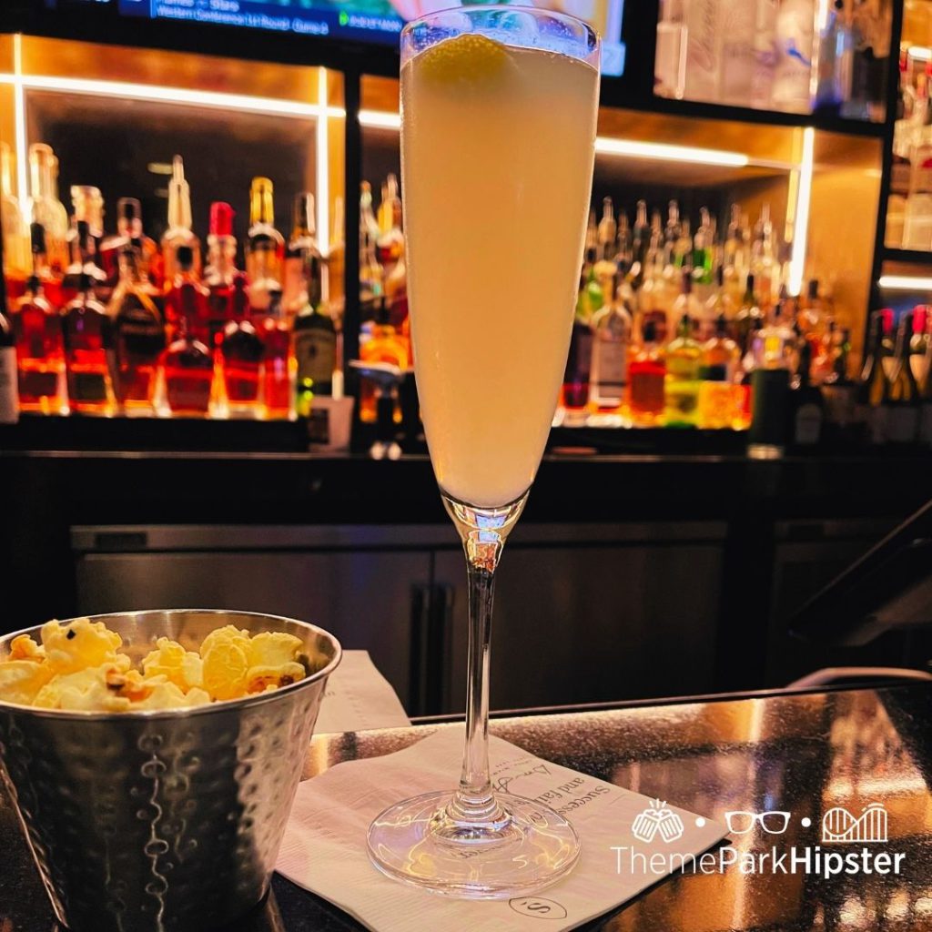 Shula's Steakhouse at Disney's Swan and Dolphin Resort French 75 featuring a glass of wine and small bites. Keep reading to discover the 25 most romantic things to do at Disney World for couples. 