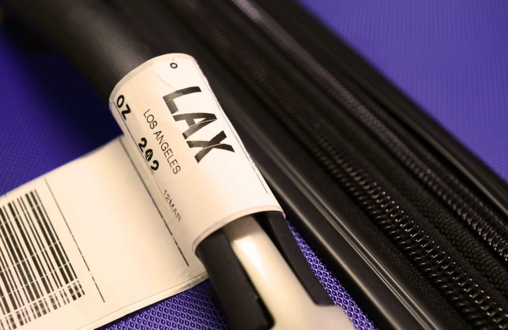 Luggage at LAX. Keep reading to learn what the best airport for Disney is. LAX or John Wayne