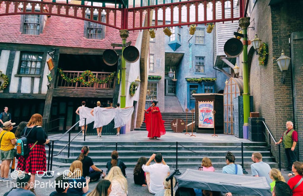 Ms Celestina Warbeck and her banshees sing holiday songs in Diagon Alley for Christmas at Wizarding World of Harry Potter