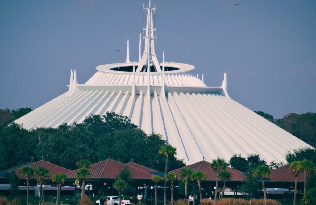 Space Mountain on a dreary day at the Magic Kingdom in Walt Disney World. Keep reading to figure out which is better for Space Mountain Disneyland vs Disney World.