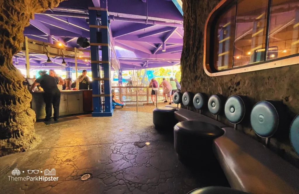 SeaWorld Orlando Resort Sharks Underwater Grill waiting area with aquatic underwater vibes. Keep reading to discover more about Sharks Underwater Grill at SeaWorld Orlando.