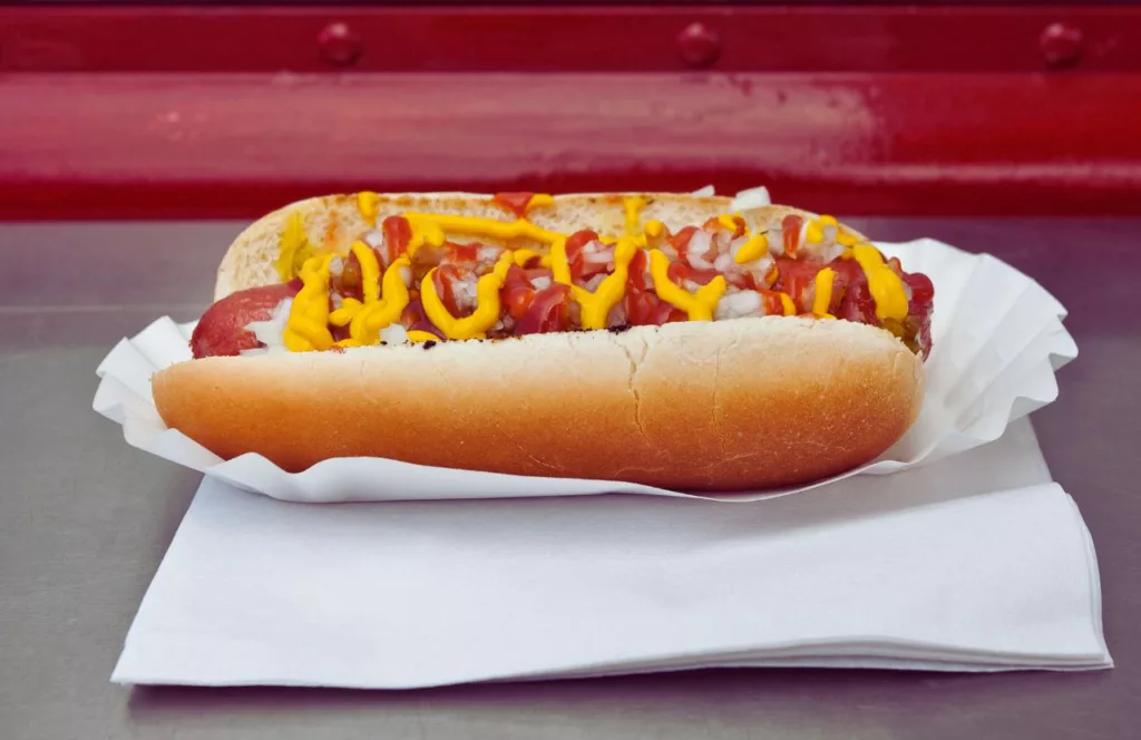 Hotdog with ketchup, mustard and diced onions. Keep reading to find out more of the best things to do in Orlando for Independence Day in Florida. 