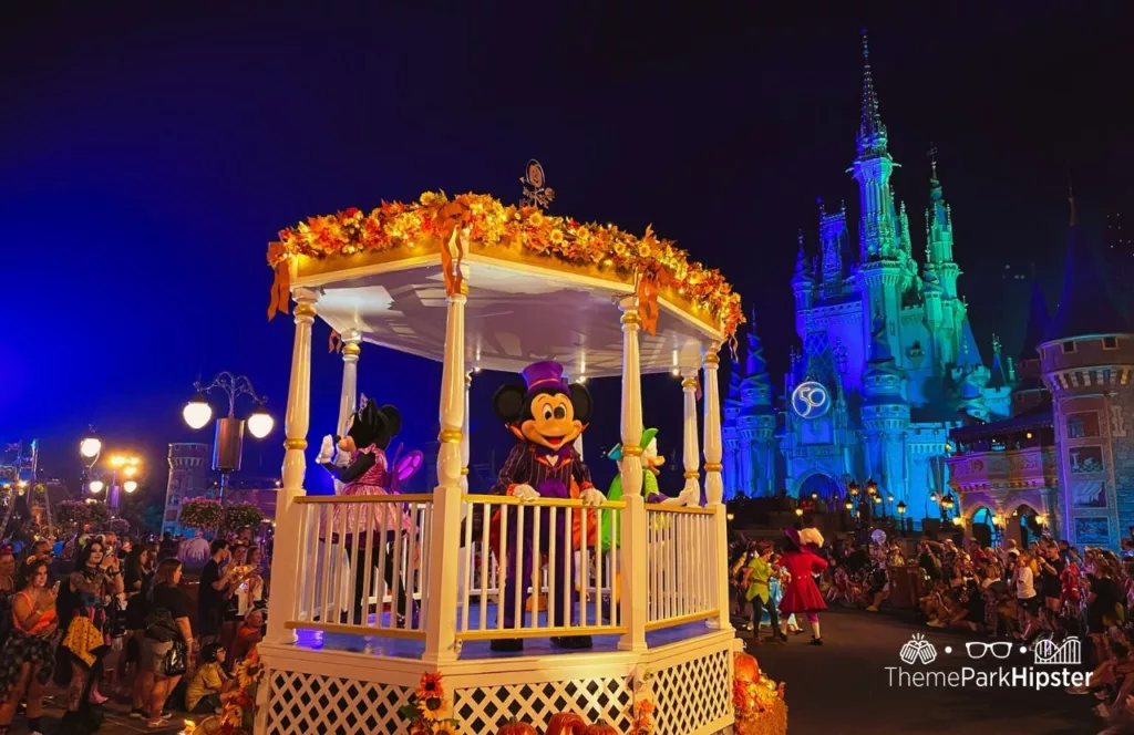 Mickey's Not So Scary Halloween Party at Disney's Magic Kingdom Theme Park Boo to You Halloween Parade in front of Cinderella Castle with characters Mickey and Minnie Mouse. One of the best Disney World bucket list items to put on your to-do list.