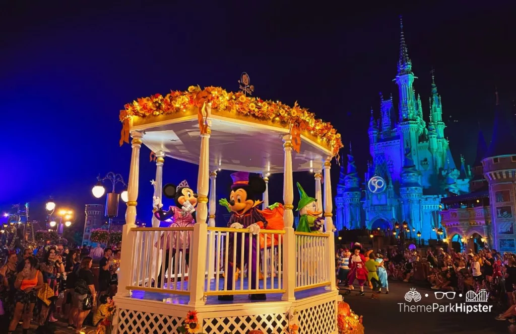 Mickey's Not So Scary Halloween Party at Disney's Magic Kingdom Theme Park Boo to You Halloween Parade in front of Cinderella Castle with characters Mickey and Minnie Mouse and Daisy Duck. Keep reading to get the best time to visit Disney World. 