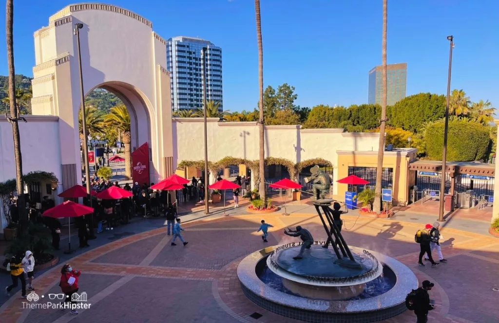 Universal Studios Hollywood Gate with Hilton Hotel Los Angeles in the background. Keep reading to get the Best Hotels Near Universal Studios Hollywood.