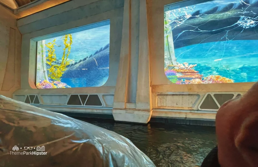 Universal Studios Hollywood Jurassic World Ride tunnel with broken glass from dinosaur Mosasaurus.