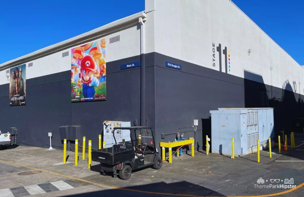 Universal Studios Hollywood backlot  Studio Tour passing by stage 11 with Super Mario Bros Movie Poster