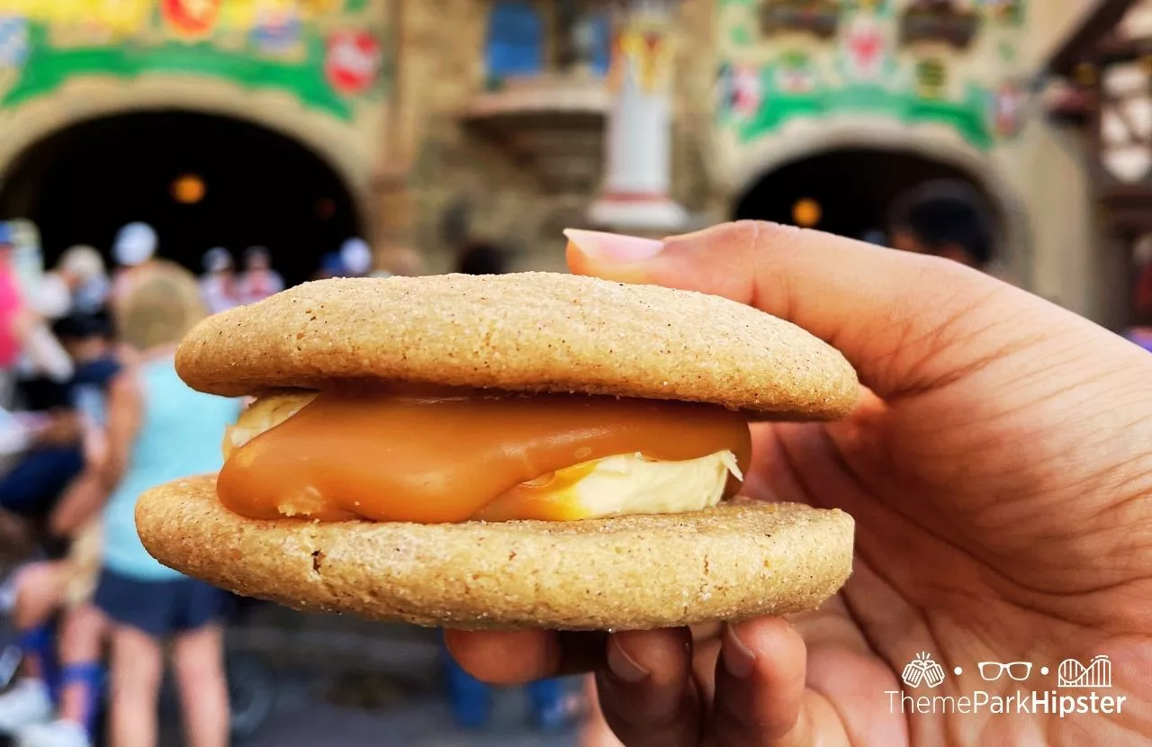 2023 Epcot Food and Wine Festival at Disney Germany Pavilion Karamell Kuche Wether's Sweet Shop Snickerdoodle Gingerbread Sandwich. One of the best quick service restaurants at Epcot.