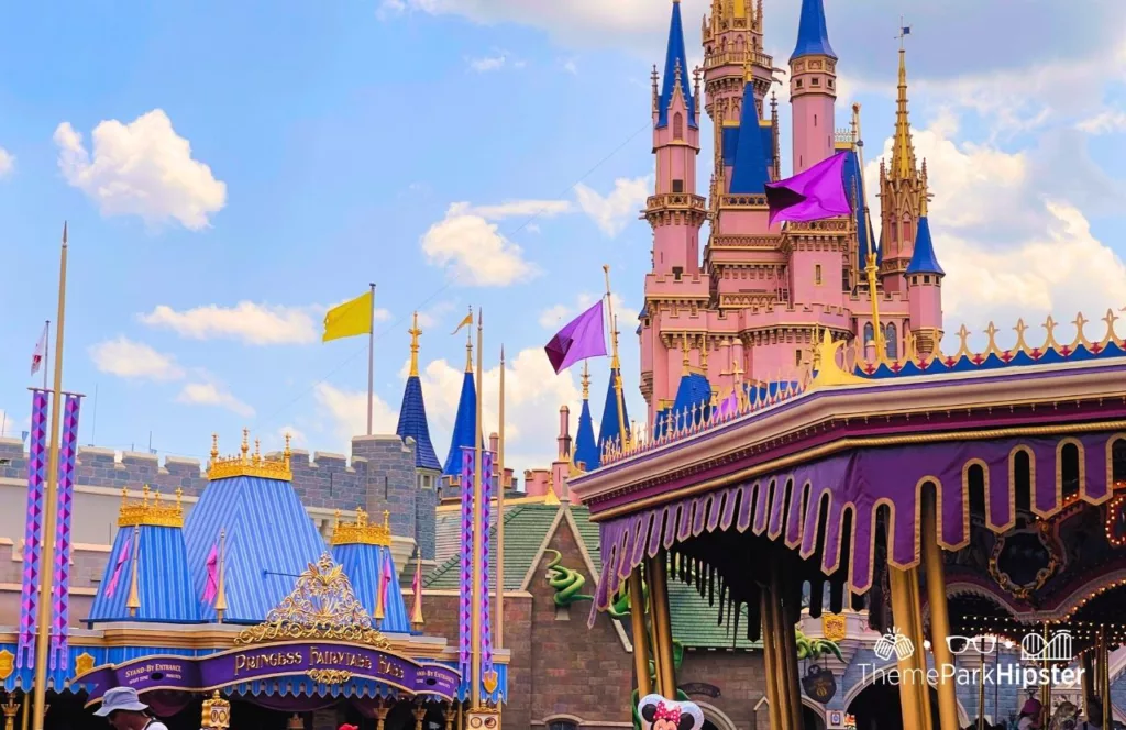 Disney Magic Kingdom Theme Park Fantasyland Carousel Ride and Cinderella Castle. Keep reading to learn how to save for Disney World.